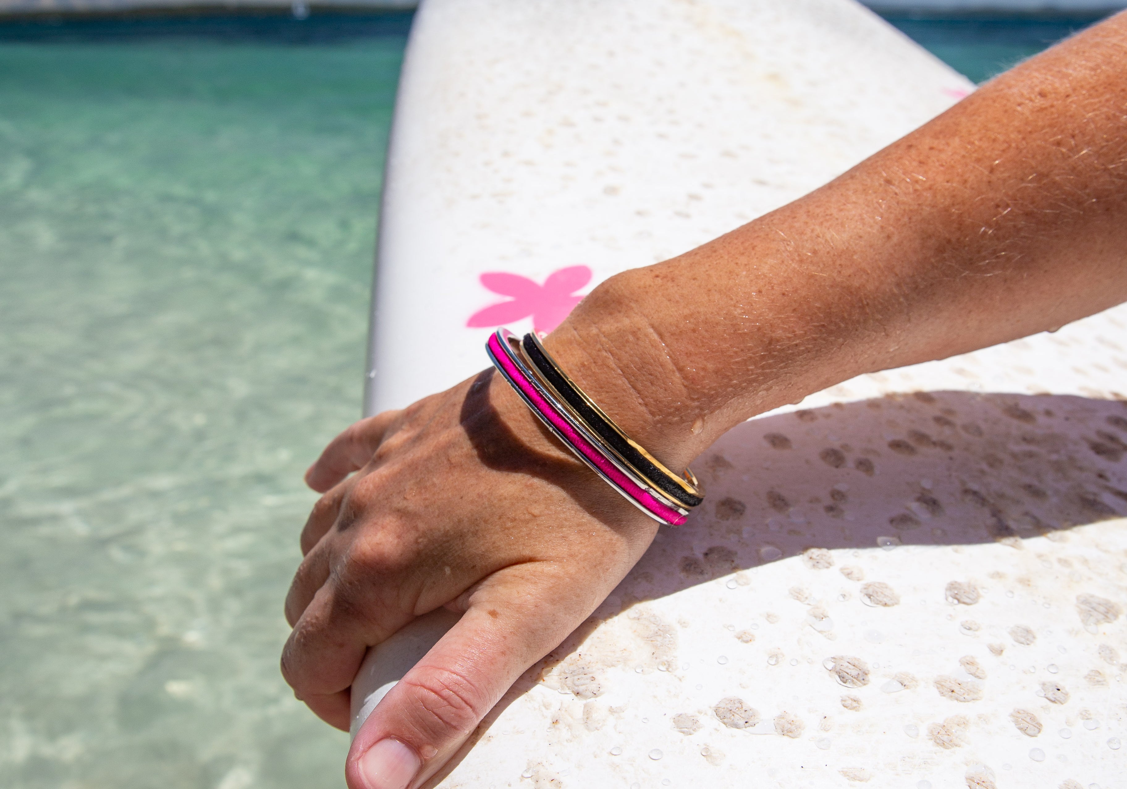 Quality waterproof jewellery that holds a hair tie