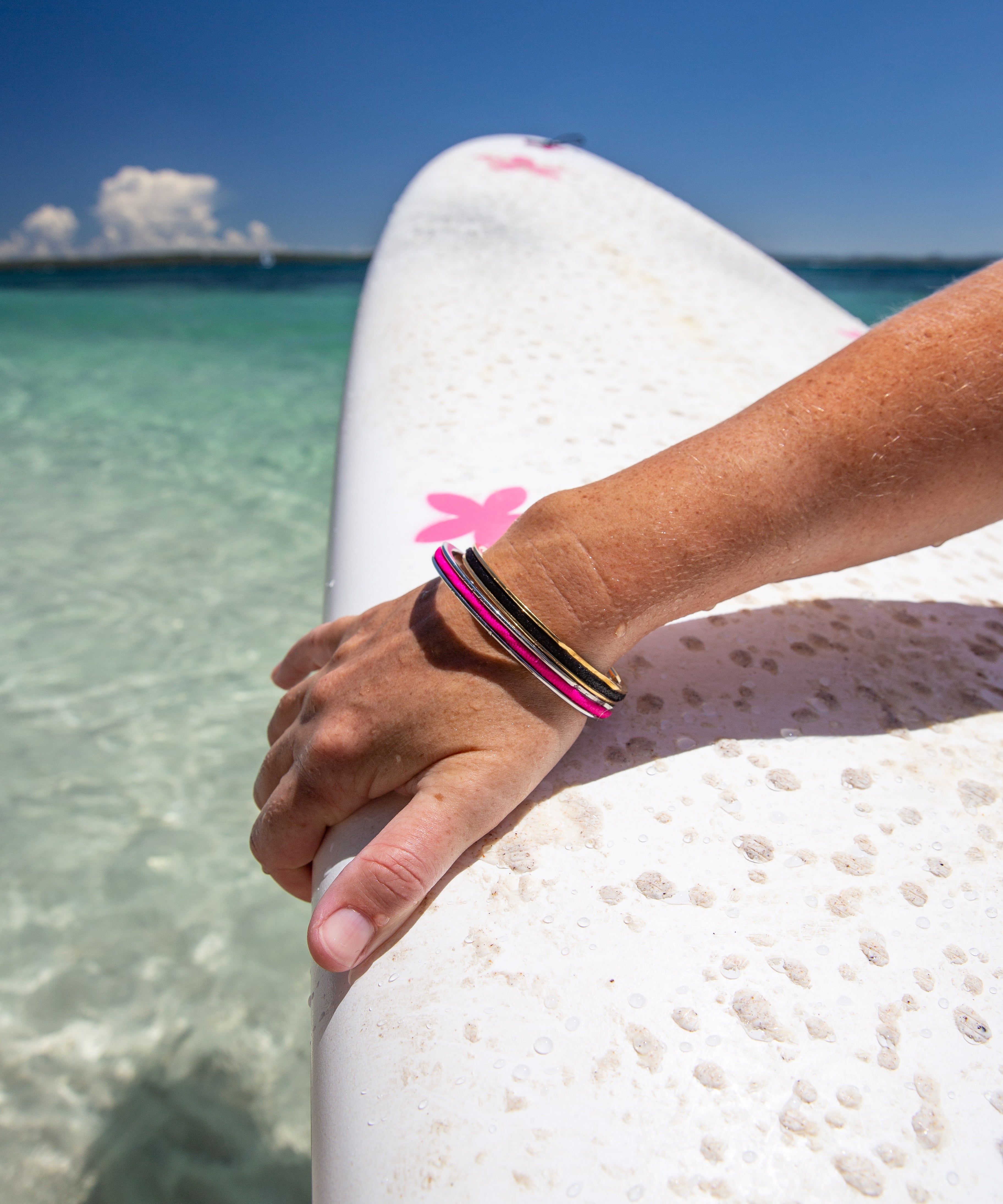 Quality waterproof jewellery that holds a hair tie