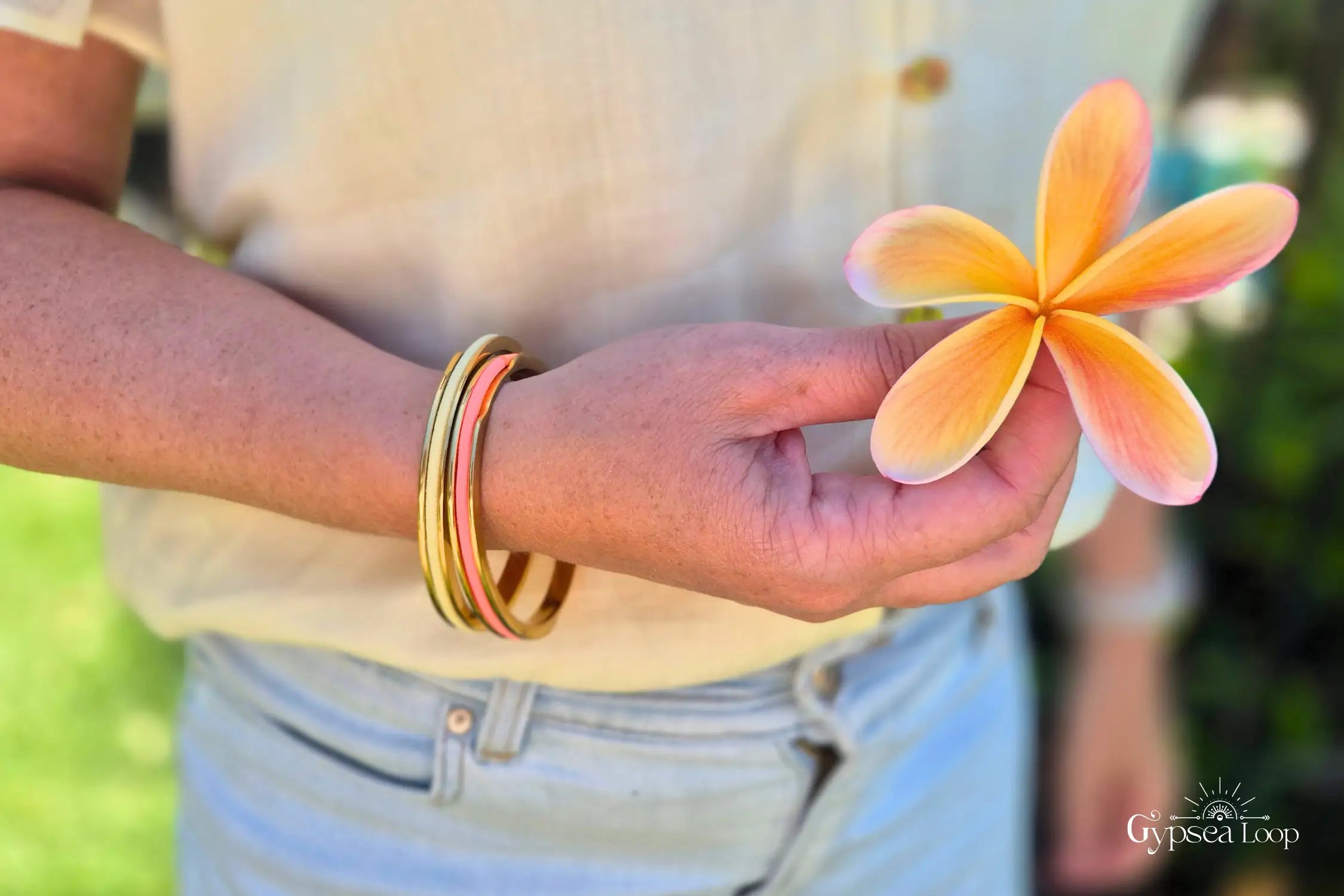 2 hair tie bangles with a flower