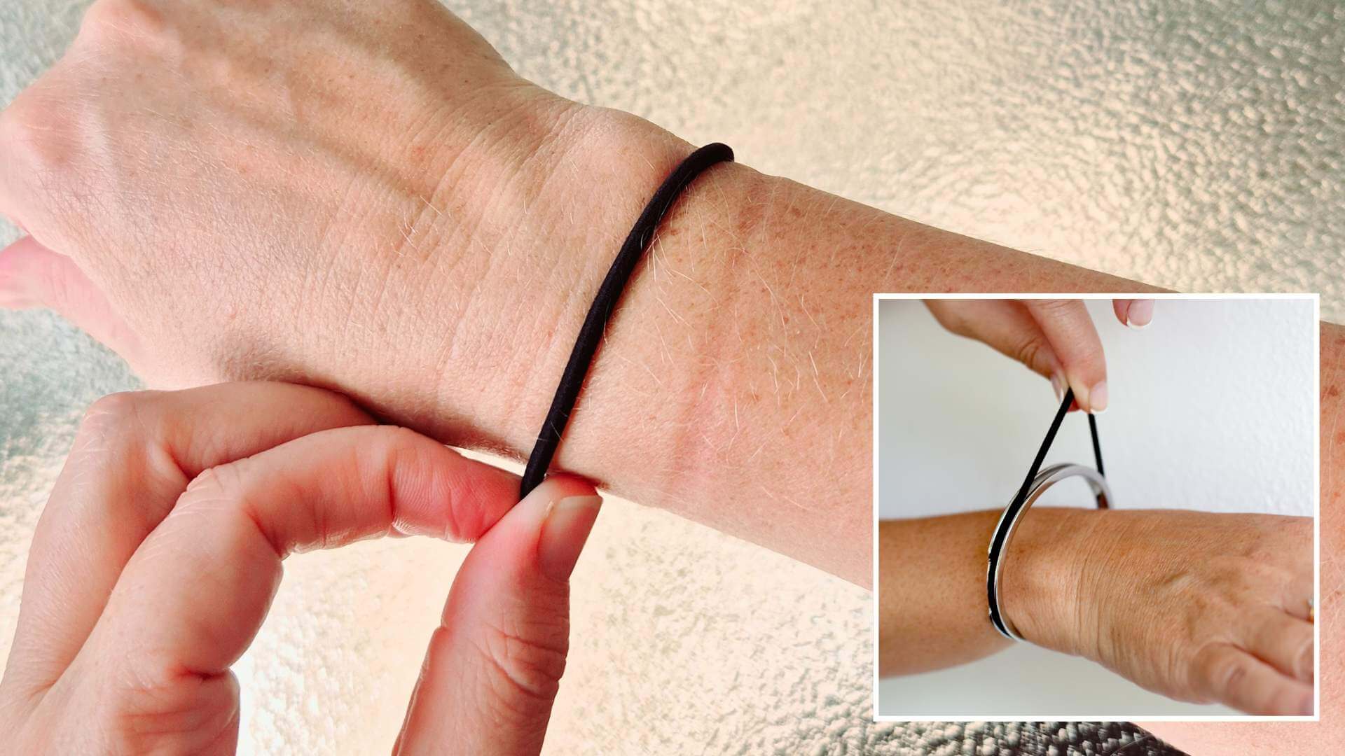 Hair tie on wrist meaning: black elastic on a bare wrist next to a Gypsea Loop hair tie bangle