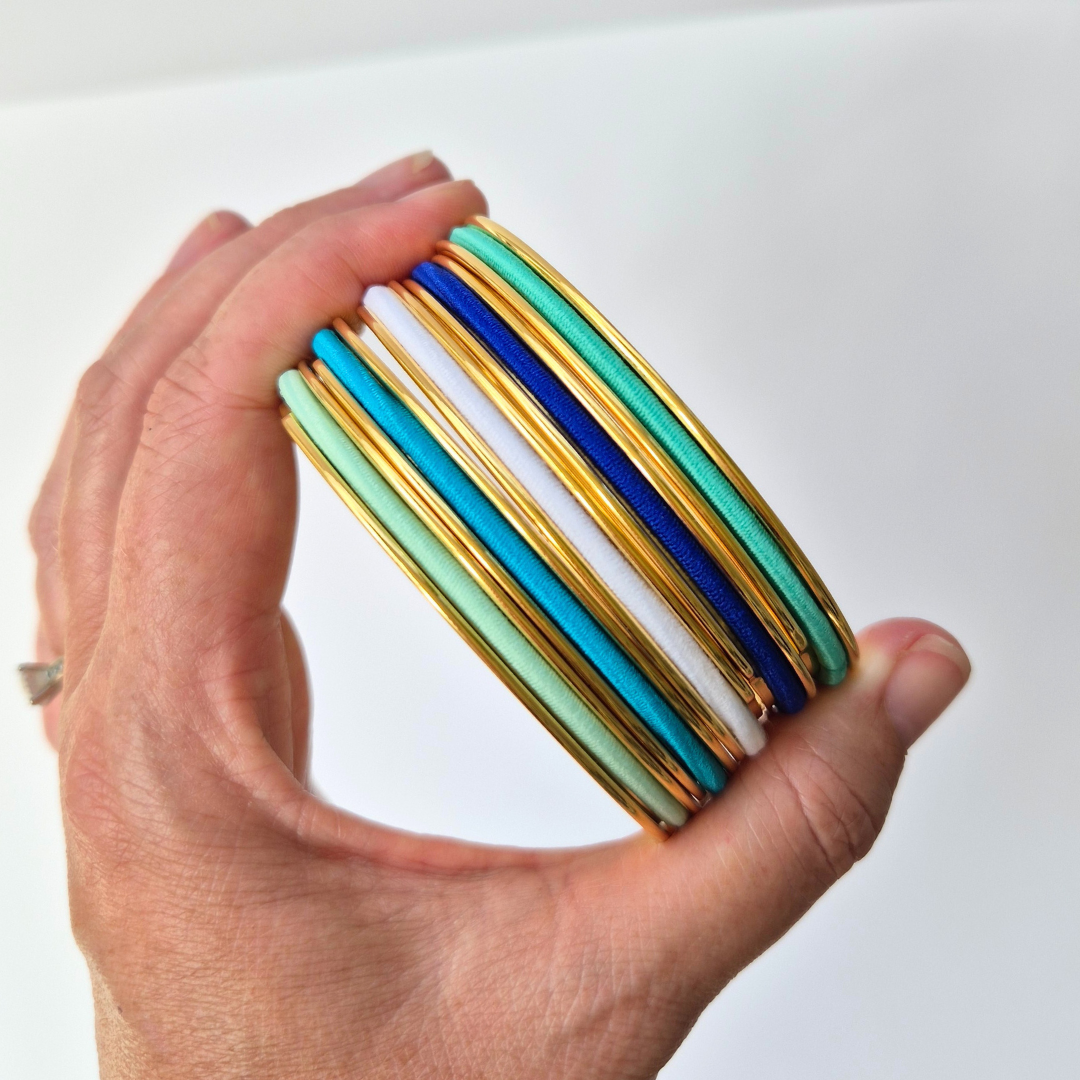 Ocean blue hair ties in gold gypsea loop hair tie bangles