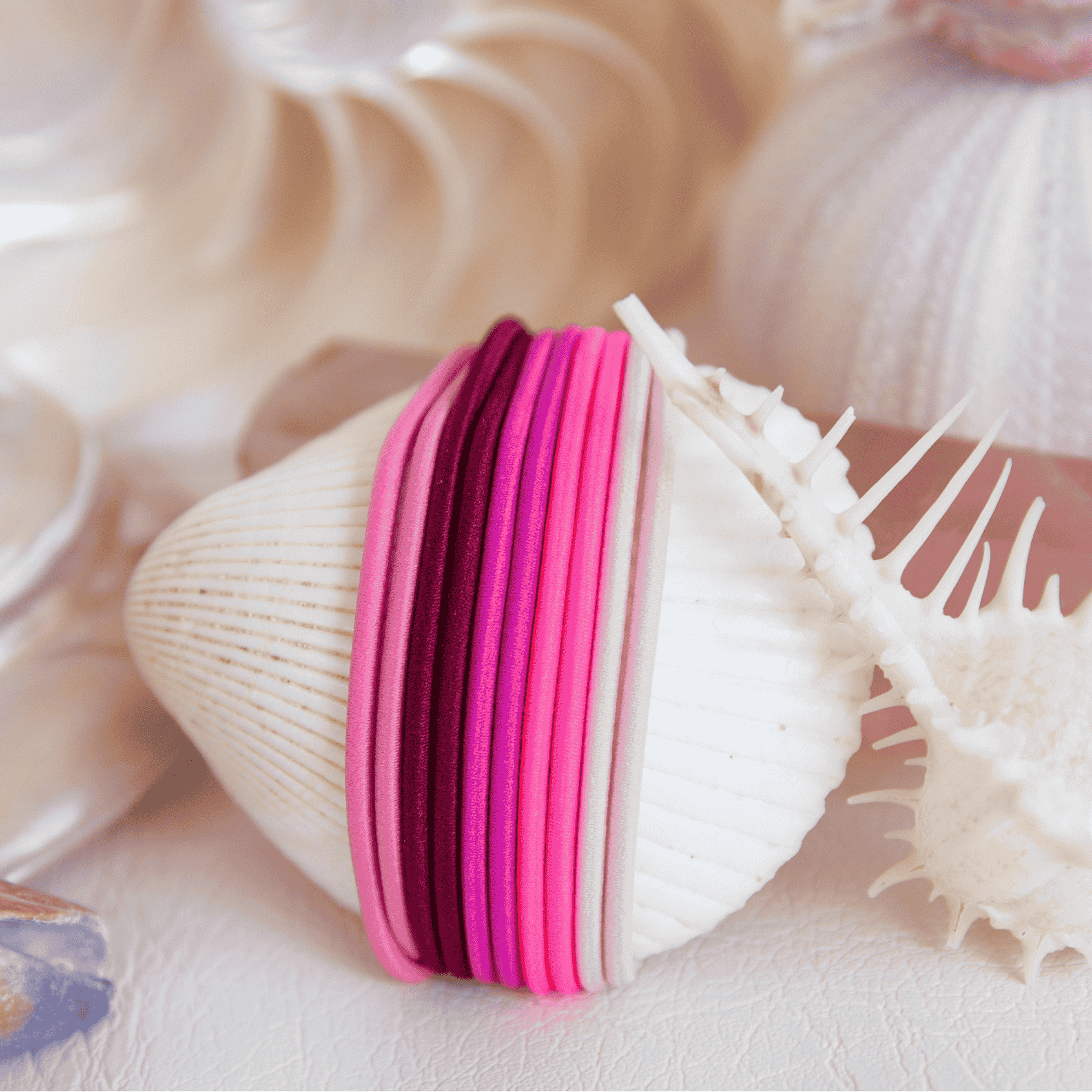 Flamingo Pink gypsea hair ties that pair with a Gypsea Loop Hair Tie Bangle