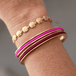 Flamingo Pink Gypsea Hair Ties stacked in hair tie bangle