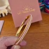 Gold Gypsea Loop Hair Tie Bangle with peach hair tie