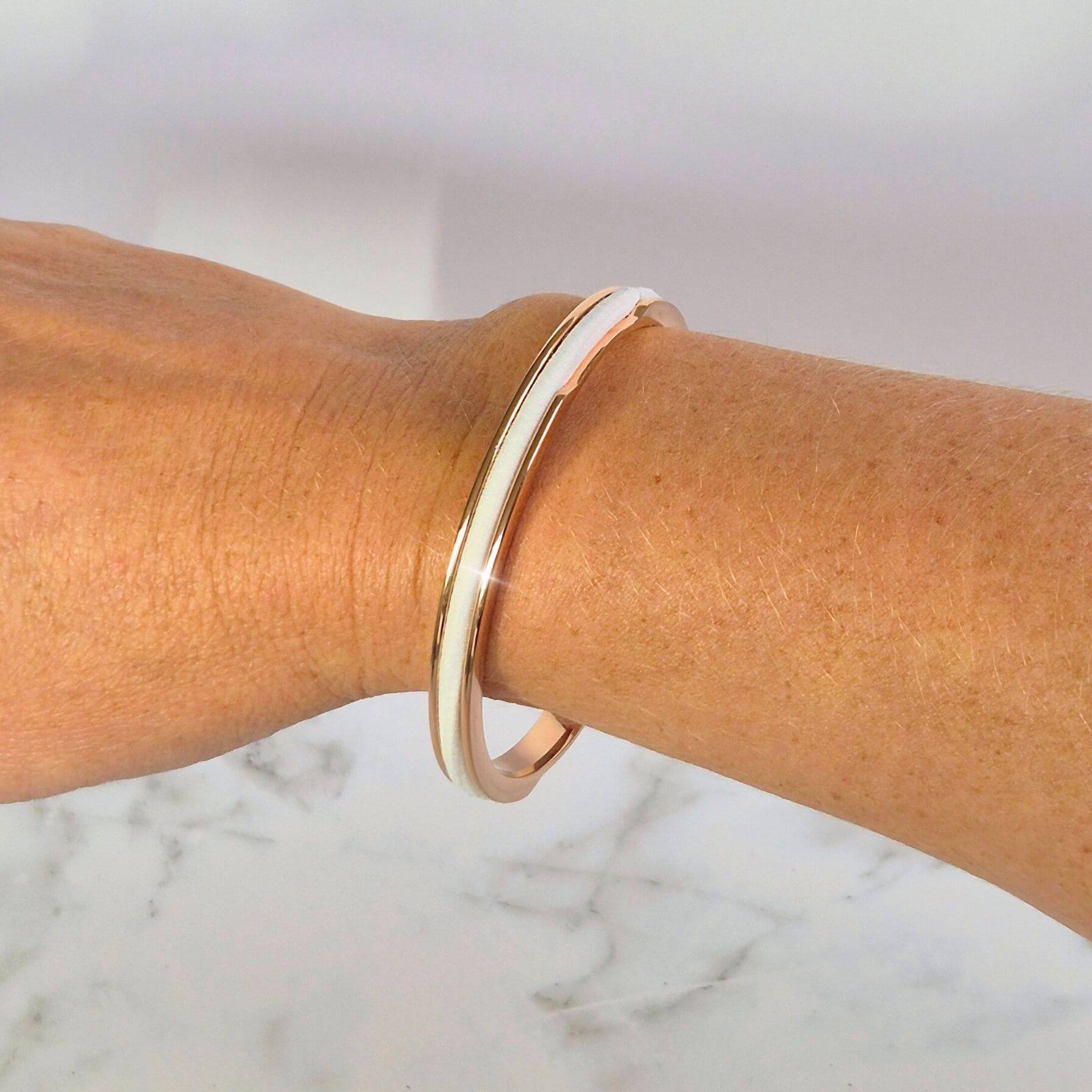 Rose Gold Gypsea Loop Hair Tie Bangle with a white hair elastic
