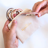 Gypsea loop bangle and hair tie travel bag. Gypsea Luxe Keep Case, hair bobble, pony tail storage bag